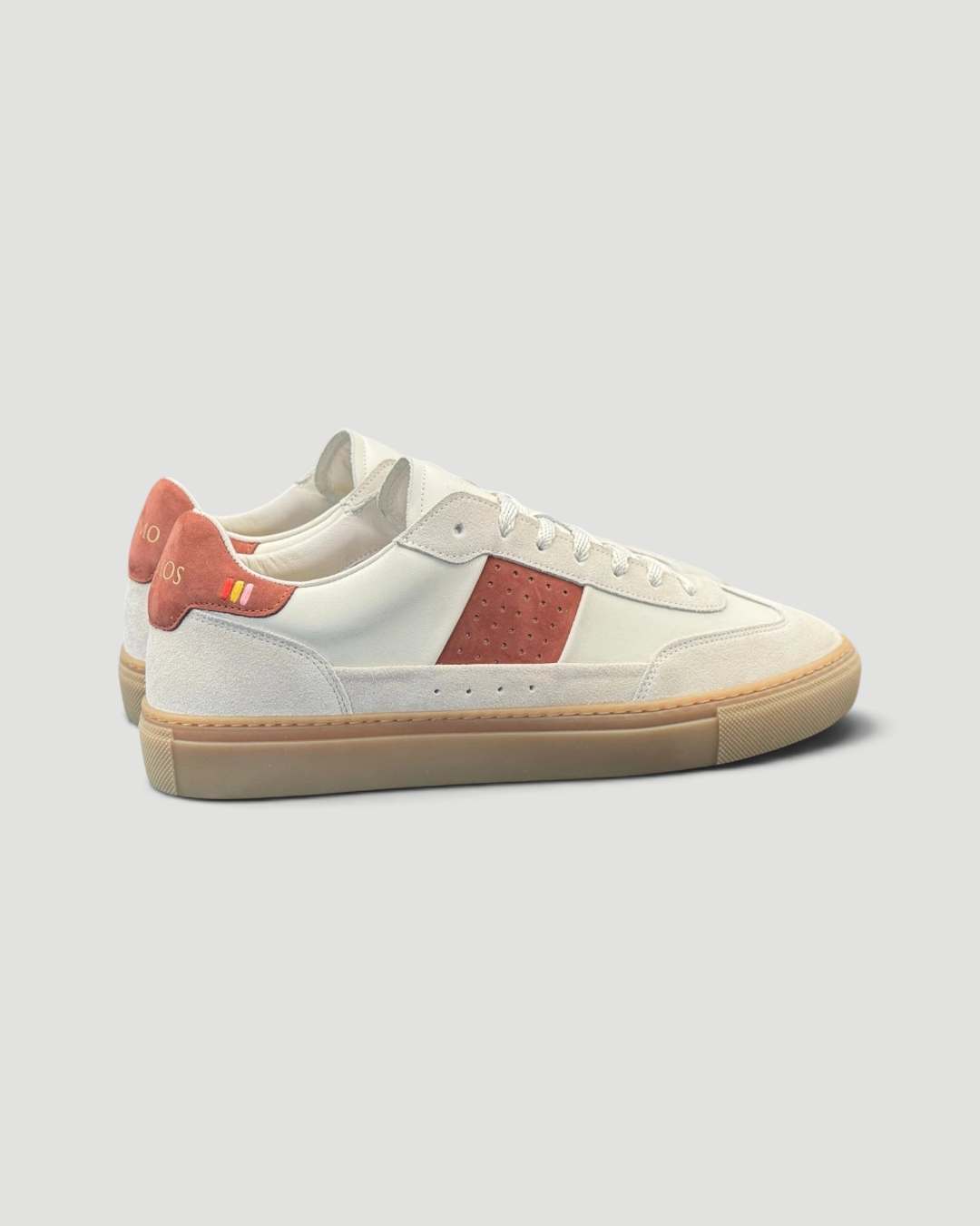 Errant Lux Court Sneaker in off-white leather and suede with reddish-brown panels and a classic gum rubber sole.