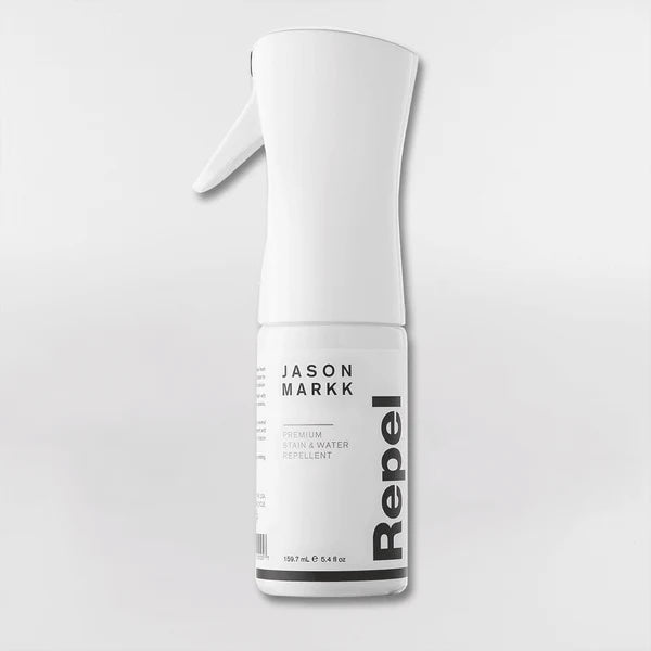 Hvid sprayflaske med etiketten "Repel" og mærket "Jason Markk".